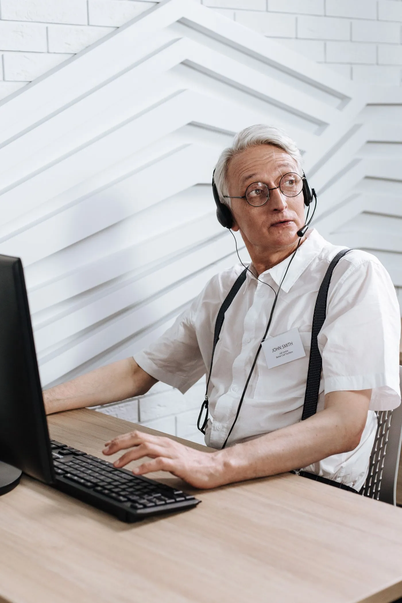 Person at a computer wearing a call headset