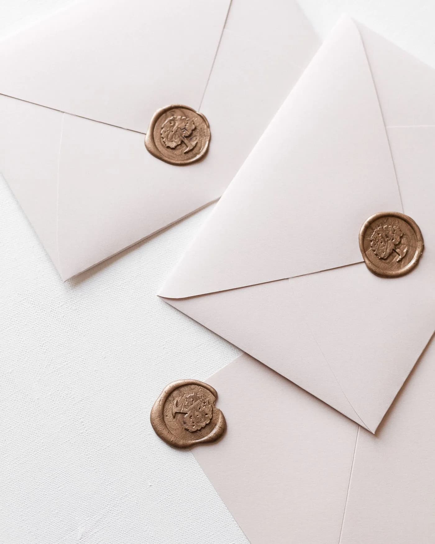 White envelopes on a table representing direct mail outreach
