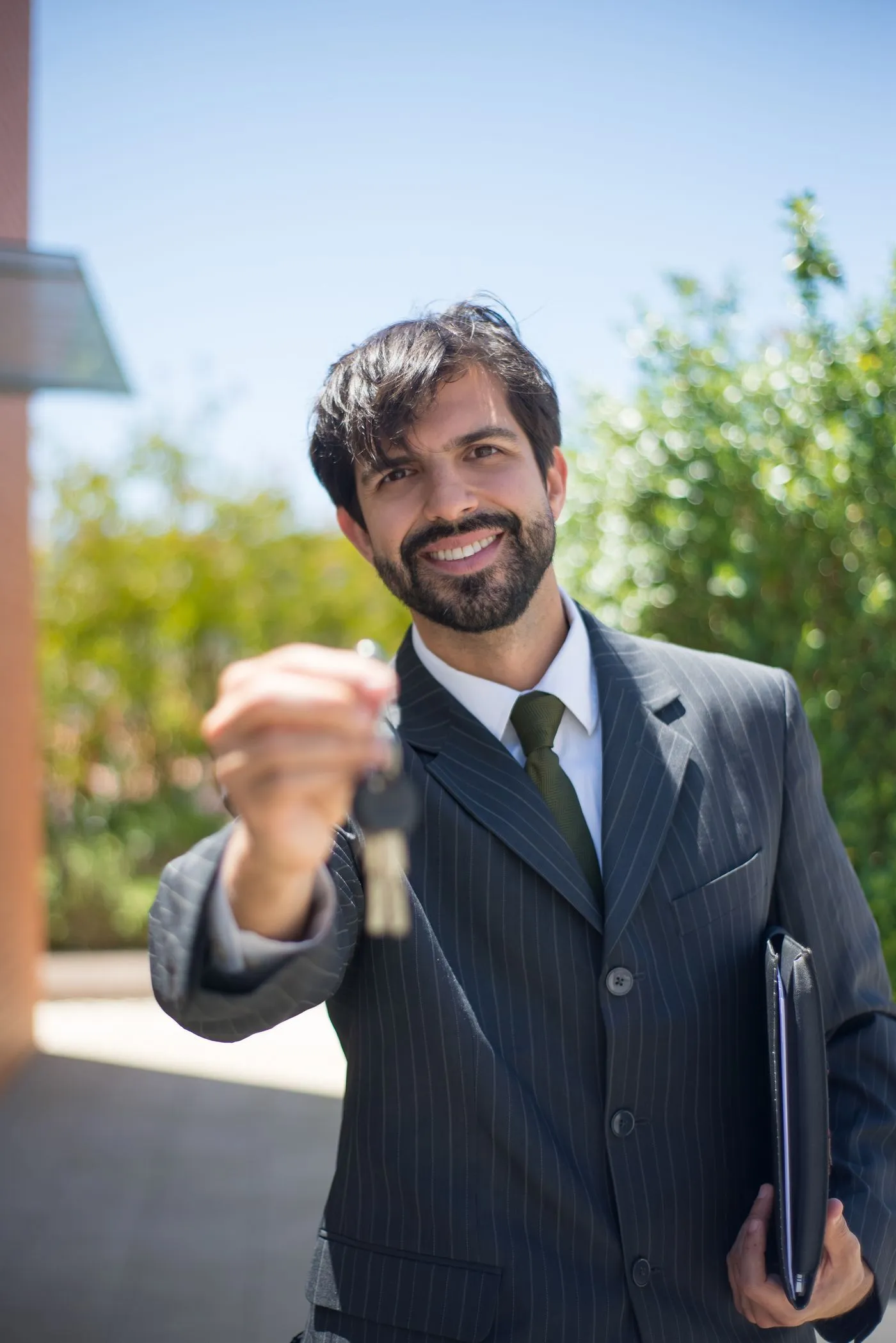 Real estate professional holding a set of house keys