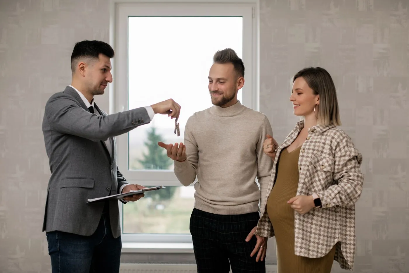 Handing house keys to new homeowners