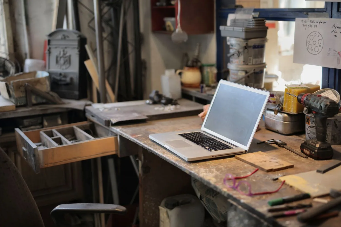 Laptop on a workbench in a small business workshop