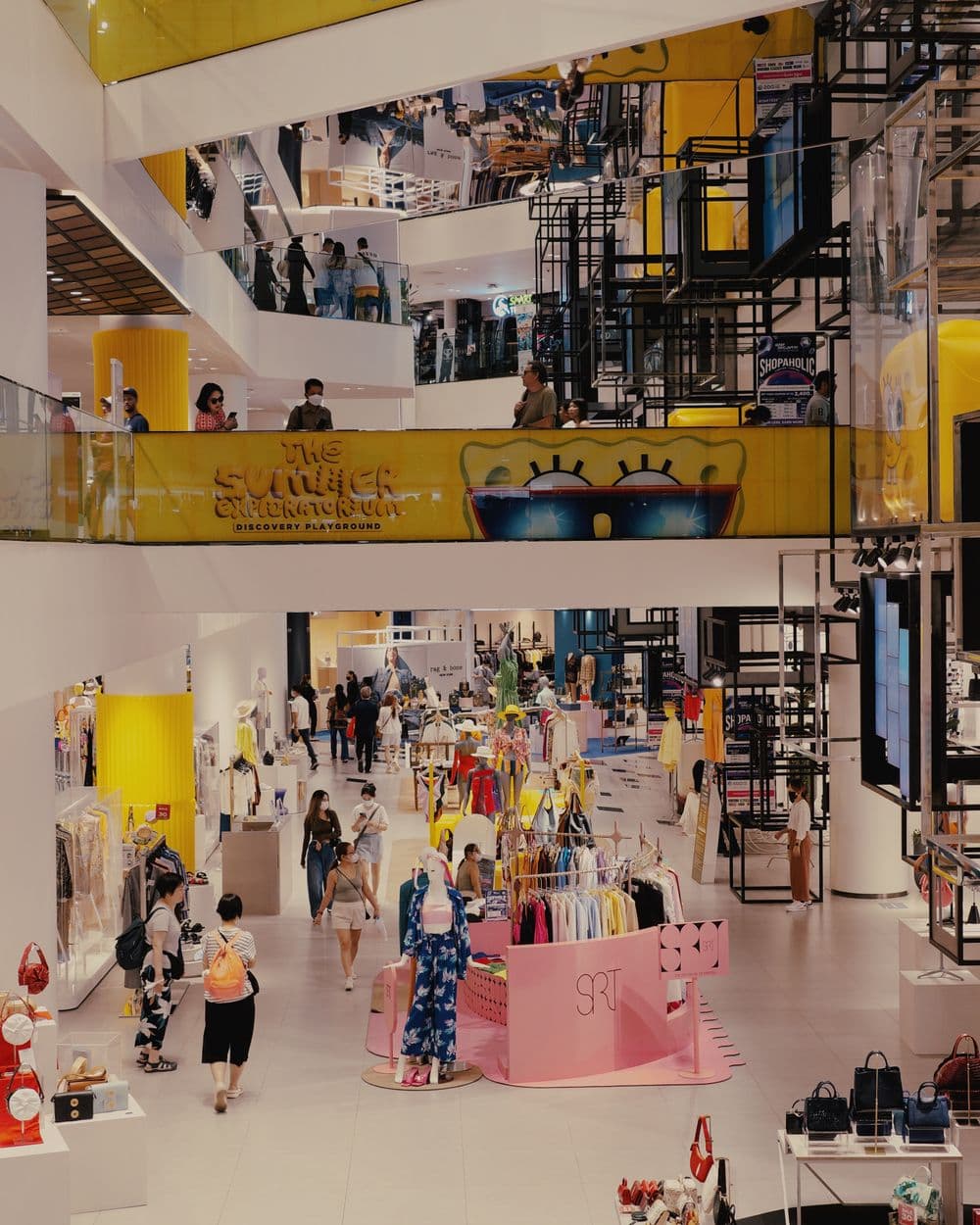 Vibrant mall filled with shoppers and fashion stores
